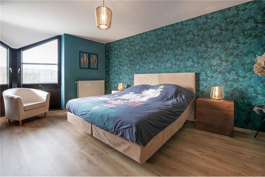 Slaapkamer op maat met geïntegreerde kasten en maatwerk inrichting
